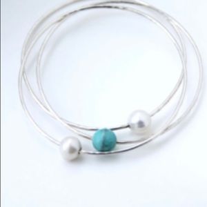 Handcrafted sterling silver Bangle bracelet with a floating pearl